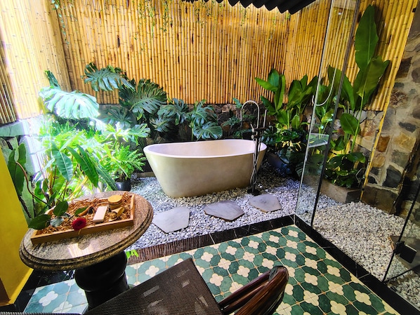 Premium Double Room, 1 King Bed, Garden Area | Bathroom amenities | Hair dryer, slippers, towels, shampoo