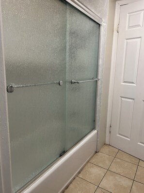 Shower, towels, soap, toilet paper