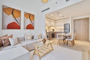 Design Apartment, Balcony, Pool View | Living room | 55-inch Smart TV with digital channels