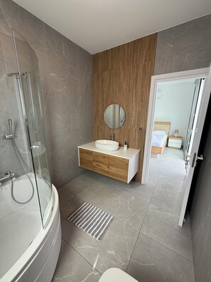 Shower, hair dryer, towels, toilet paper