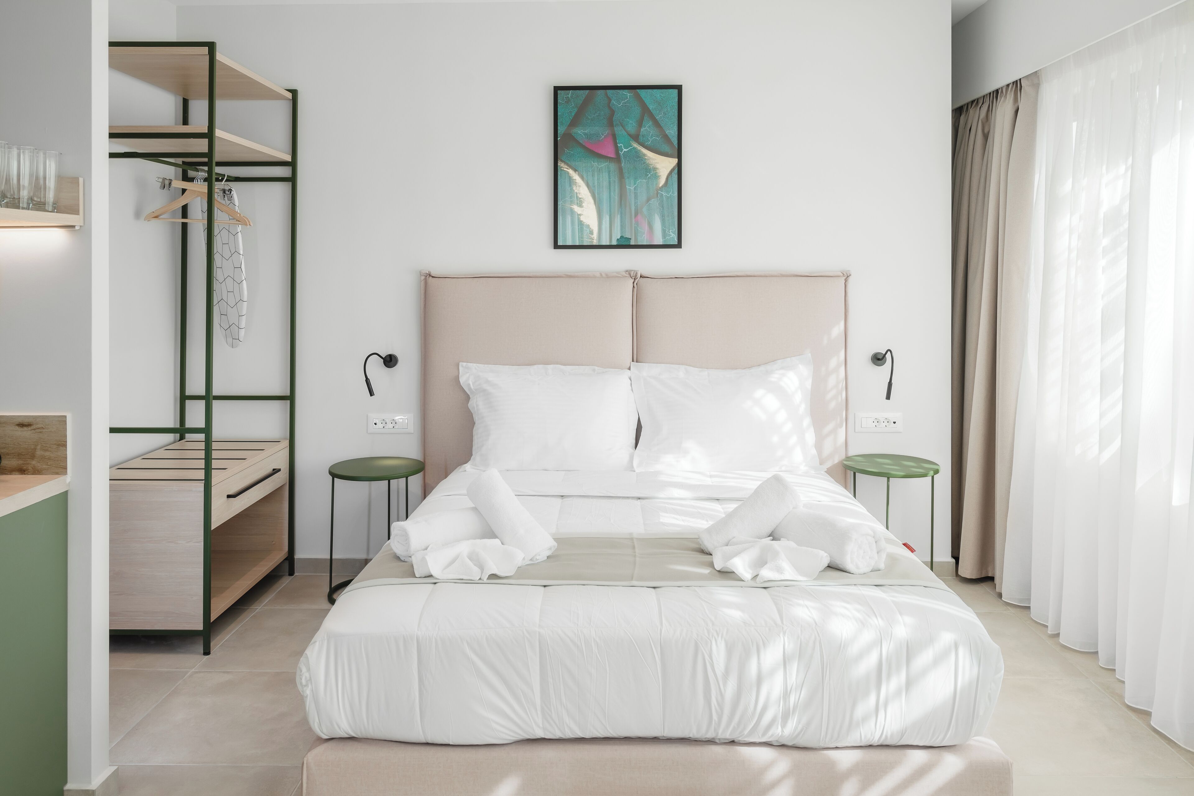 A modern bedroom with a bed, a built-in wardrobe, and a bedside table.
