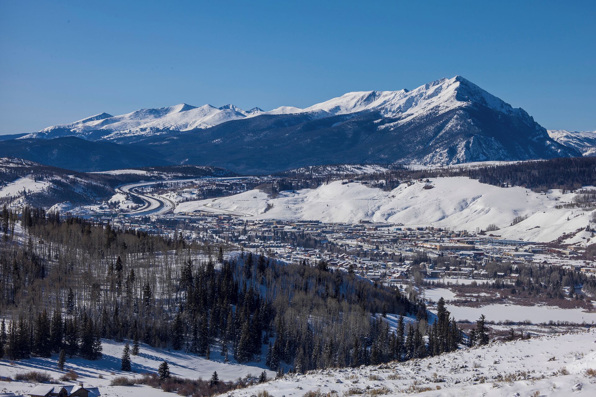 A mountainous landscape with a town in the valley.