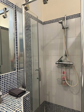 Shower, hair dryer, towels, soap
