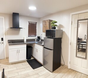 Fridge, microwave, stovetop, coffee/tea maker