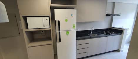 Fridge, microwave, cookware/dishes/utensils
