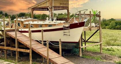 Land Ahoy! A historic boat, anchored in acres of greenery. 1 of a kind adventure