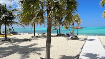 On the beach, sun-loungers, beach towels