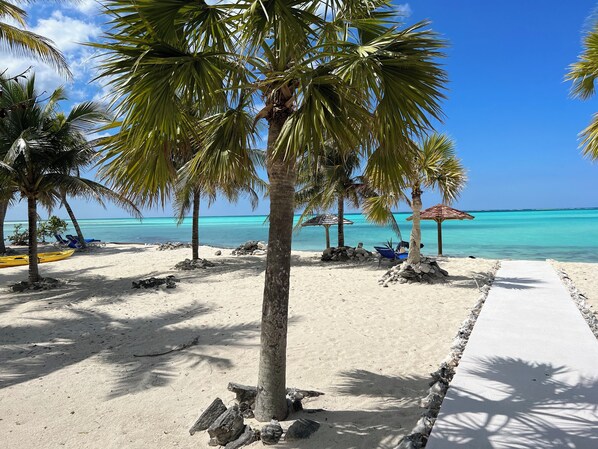 On the beach, sun loungers, beach towels