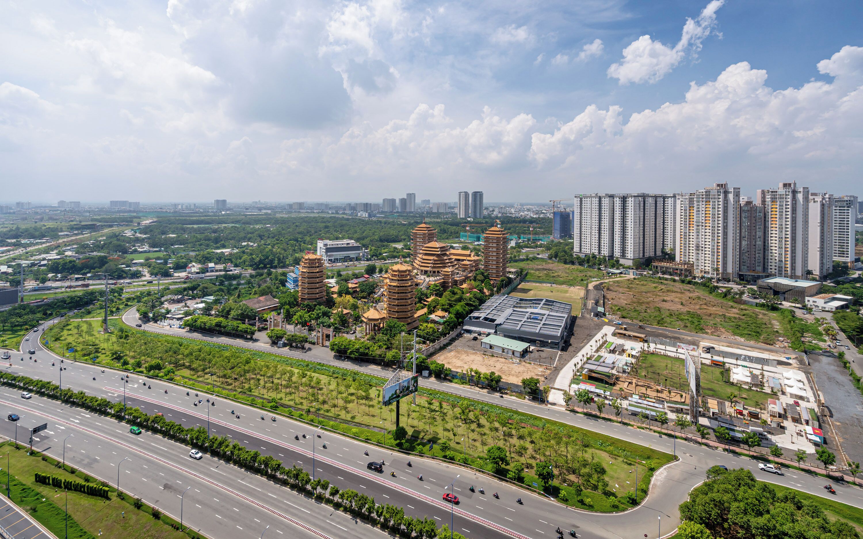 A modern urban area with a mix of traditional pagoda-style buildings and high-rise residential buildings.