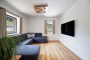 Deluxe Apartment | Living area | Heated floors