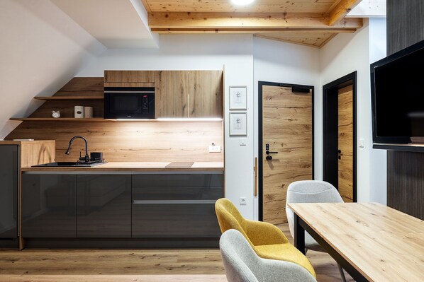 Premium Apartment | Private kitchen | Coffee/tea maker, electric kettle, highchair, dining tables
