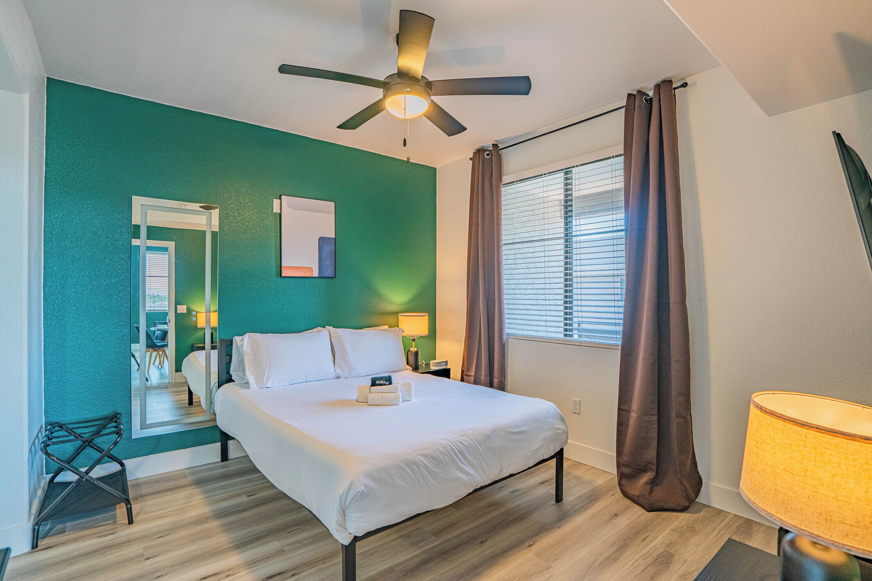 Executive Apartment, 1 Bedroom, Balcony, Pool View | Desk, laptop workspace, blackout drapes, iron/ironing board