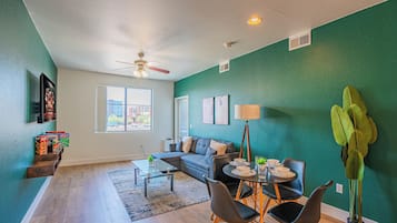 Premier Apartment, 1 Bedroom, Non Smoking, Pool View | Living area | 55-inch Smart TV with digital channels