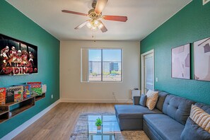 Premier Apartment, 1 Bedroom, Non Smoking, Pool View | Living area | 55-inch Smart TV with digital channels