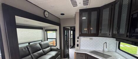 Fridge, microwave, stovetop, coffee/tea maker