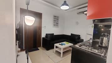 Apartment, 1 Bedroom, Accessible, Smoking | Living room | Flat-screen TV