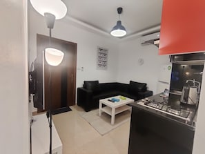 Apartment, 1 Bedroom, Accessible, Smoking | Living room | Flat-screen TV