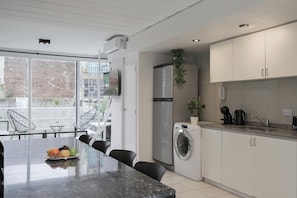 Apartment, 2 Bedrooms | Private kitchen | Microwave, oven, stovetop, cookware/dishes/utensils
