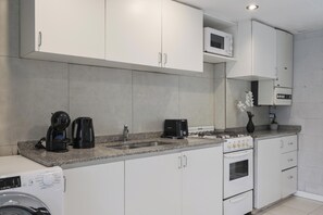 Comfort Apartment, City View | Private kitchen | Microwave, oven, stovetop, cookware/dishes/utensils