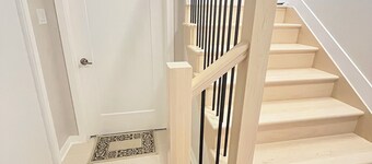 Entire basement with large windows, private full bathroom and office