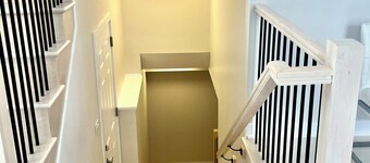 Entire basement with large windows, private full bathroom and office