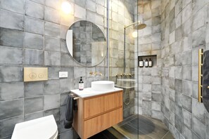 Shower, hair dryer, towels, soap