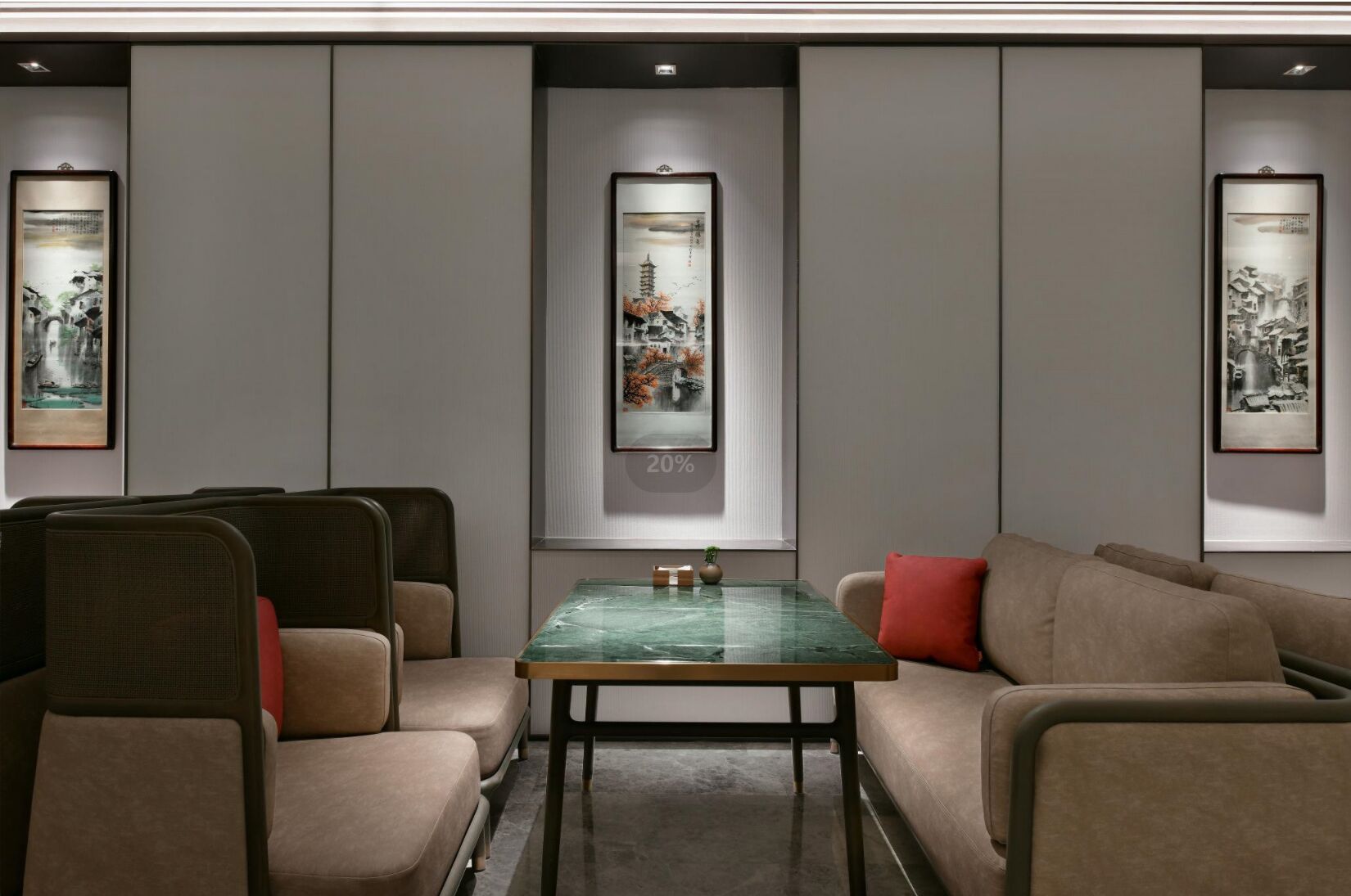 A modern conference room with a glass table, beige upholstered chairs, and a sofa.