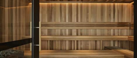 A sauna with wooden benches and a sloped ceiling.