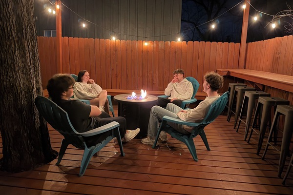 Large back deck with a gas fire pit and plenty of seating