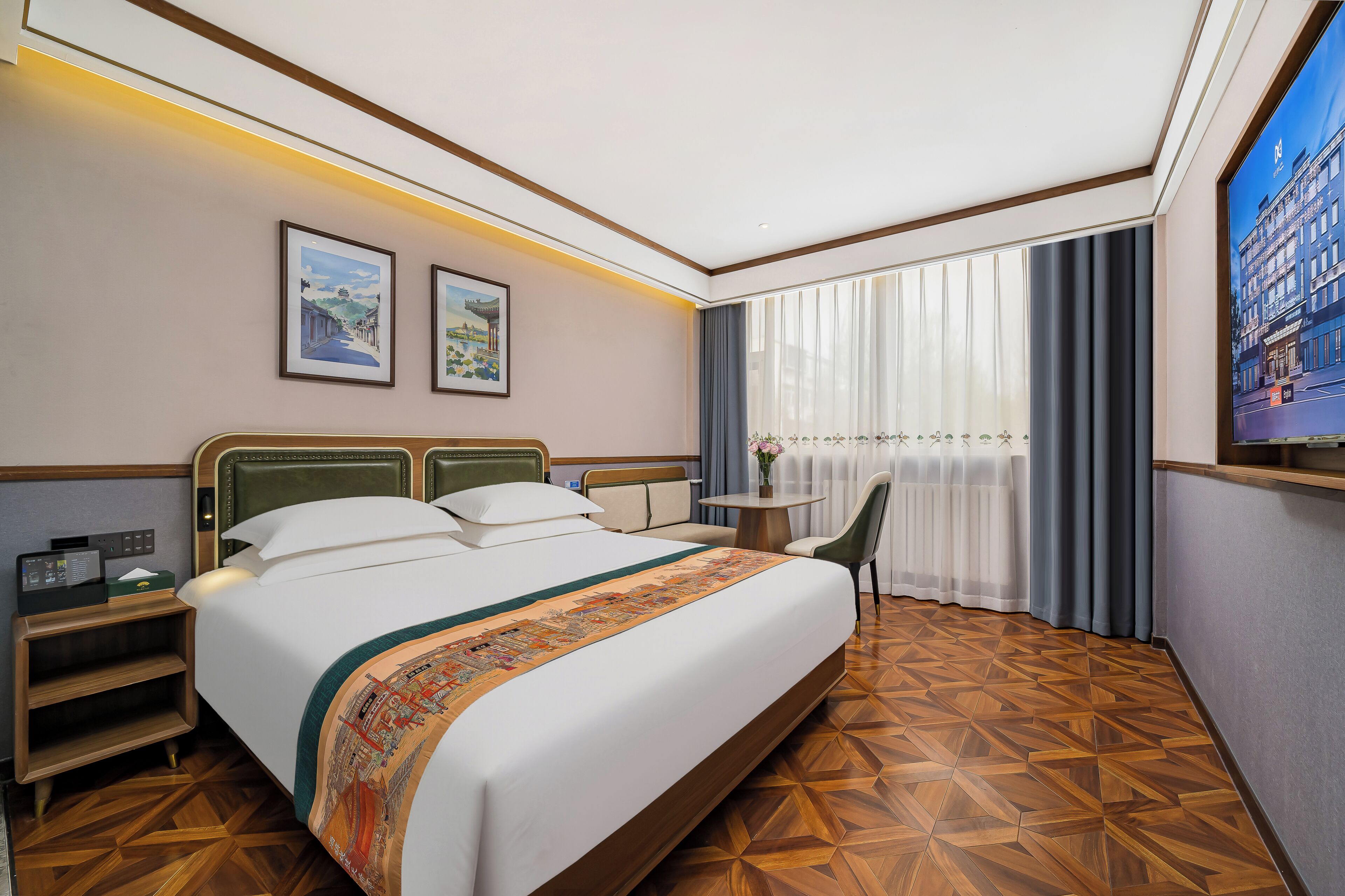 A hotel room with a bed, a desk, a chair, a TV, and a window with curtains.