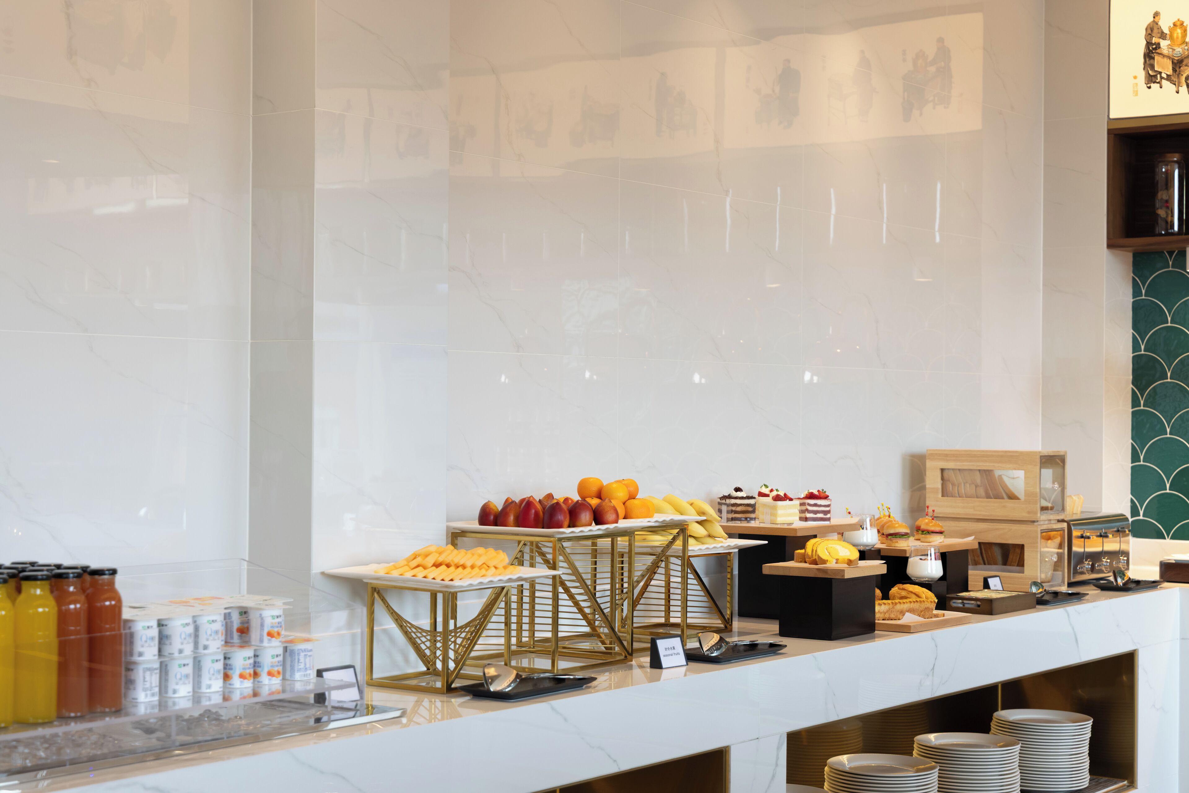 A buffet with various food items and beverages.