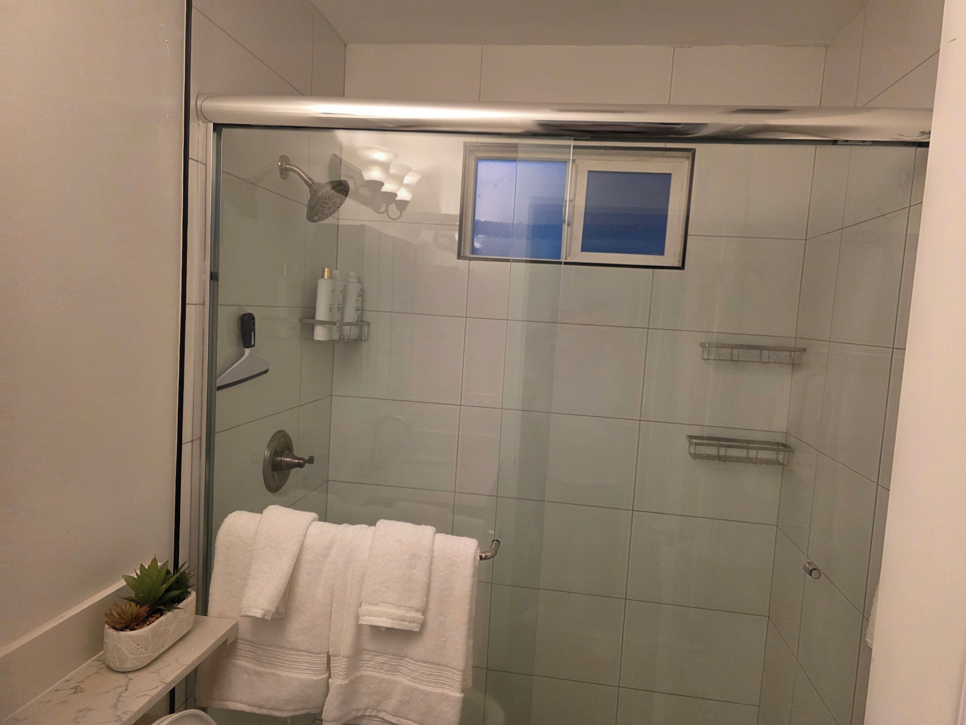 Shower, hair dryer, towels, soap