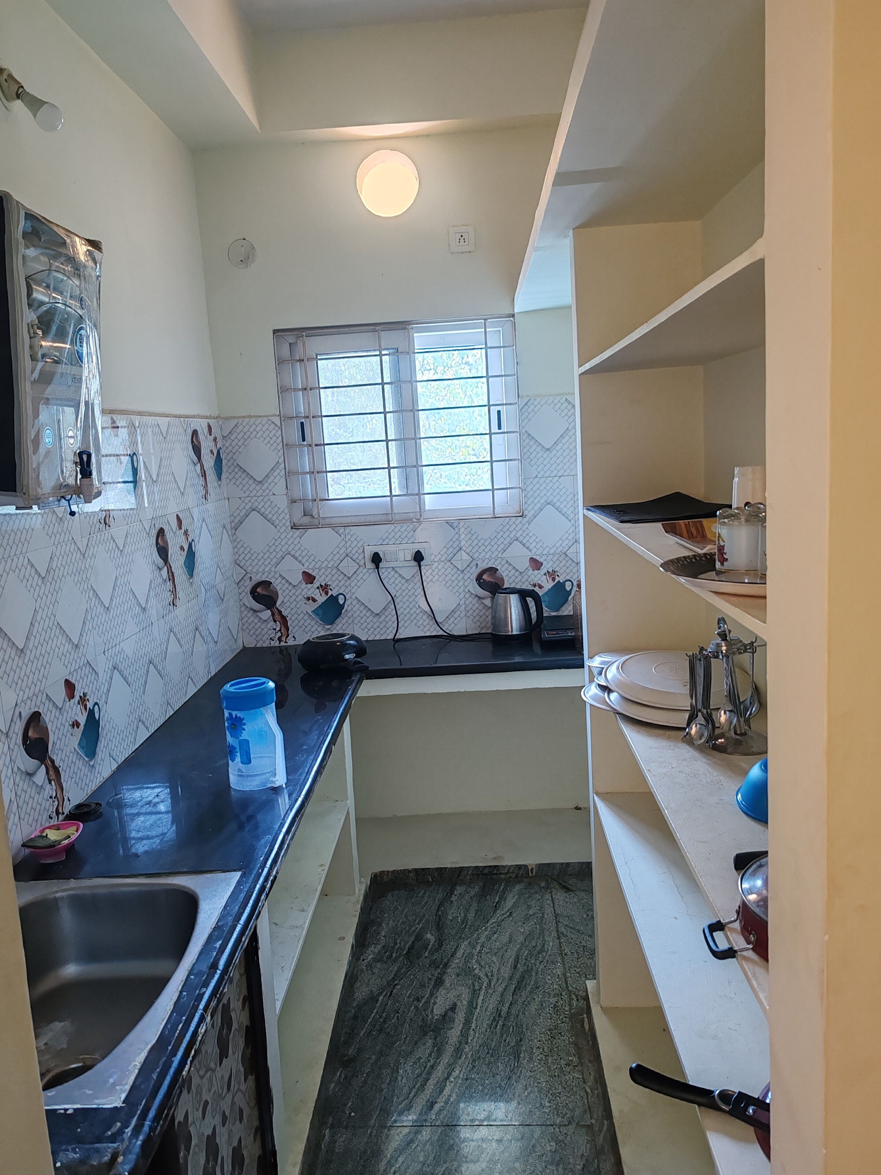 Fridge, stovetop, electric kettle, cookware/dishes/utensils