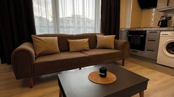 Economy Condo, 1 Queen Bed with Sofa bed, Kitchen | Living area | 32-inch Smart TV with digital channels