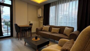 Economy Condo, 1 Queen Bed with Sofa bed, Kitchen | Living area | 32-inch Smart TV with digital channels