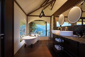 Separate bathtub and shower, free toiletries, hair dryer, bathrobes
