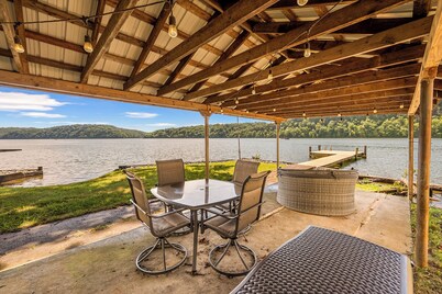 Lakefront retreat with private dock, open living, fire pit, full kitchen & cozy indoor spaces