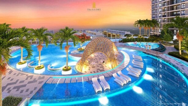 A luxurious hotel with a large infinity pool, palm trees, and a modern architectural design. - Homie's The Glory Apartment (Ho Chi Minh City)