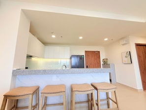 Family Apartment, Balcony, City View | Shared kitchen facilities | Fridge, microwave, stovetop, dining tables