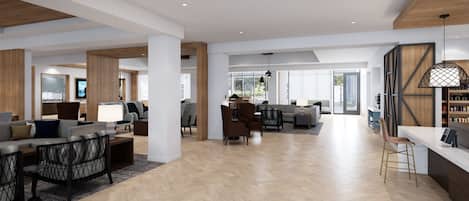 Un salón amplio y moderno con suelo de madera en espiga, un comedor también con un diseño de espiga, y una cocina visible al fondo.