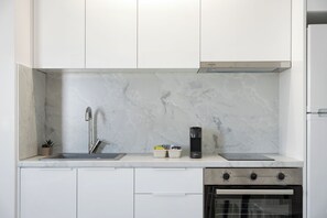 Fridge, stovetop, coffee/tea maker, cookware/dishes/utensils