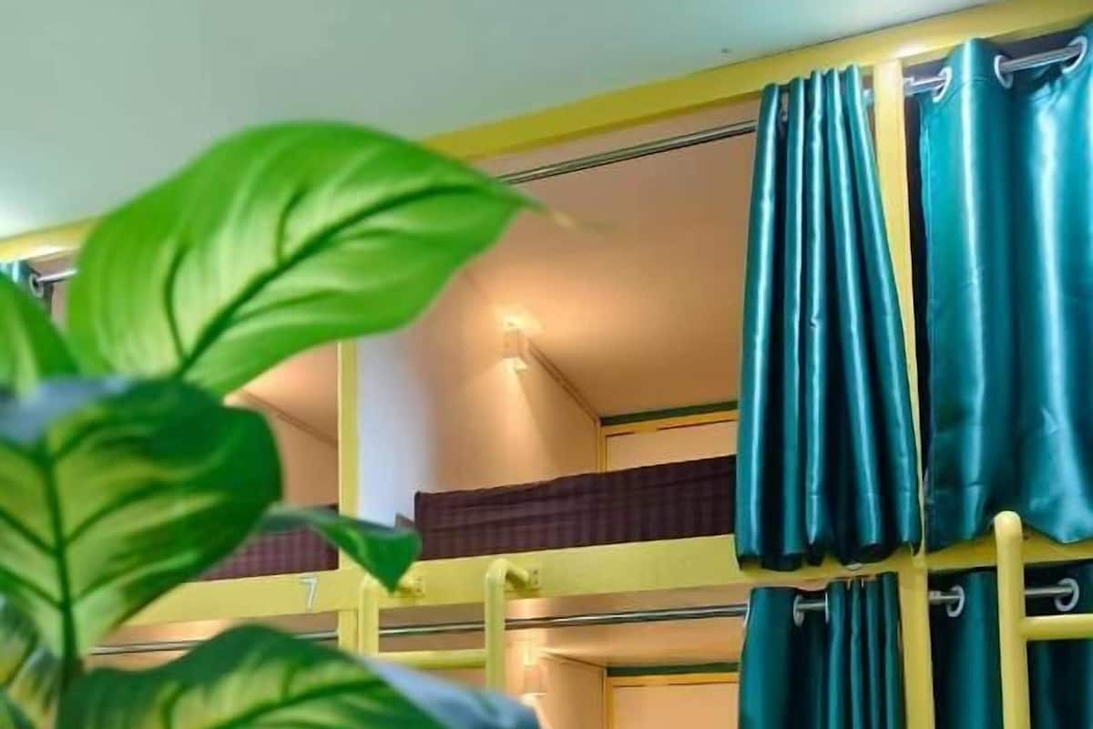 Desk, laptop workspace, blackout drapes, iron/ironing board