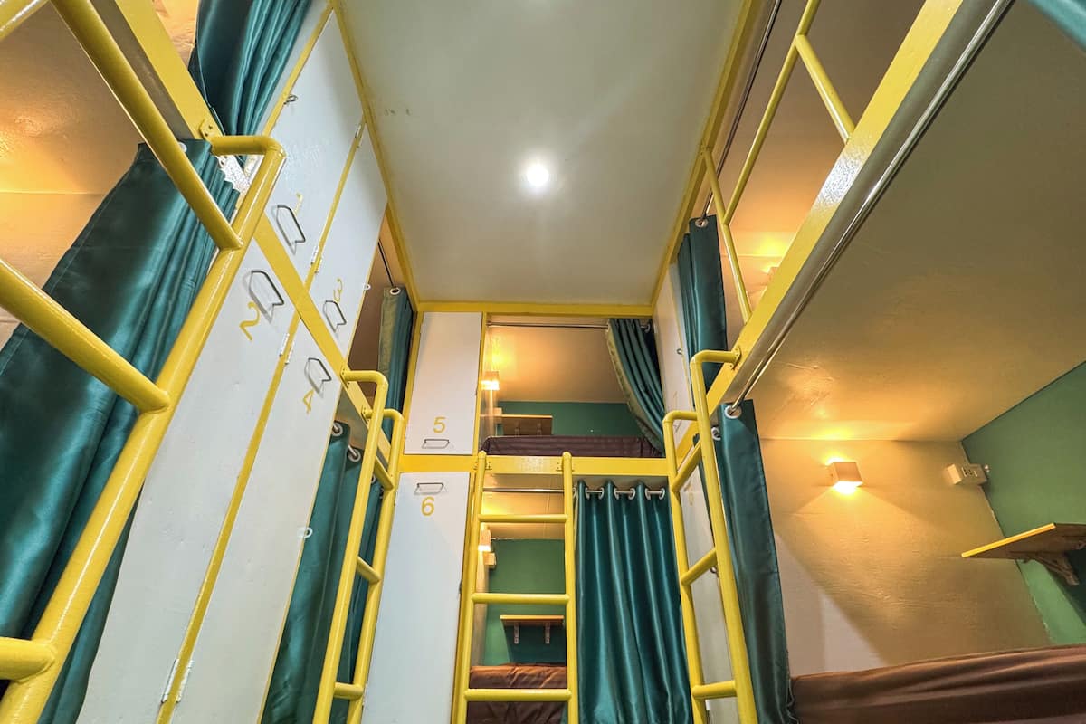 Desk, laptop workspace, blackout drapes, iron/ironing board