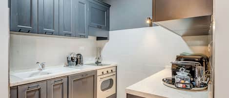 Apartamento Deluxe, vistas a la ciudad | Cocina privada