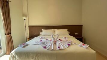 Deluxe Room, Pool View | In-room safe, desk, laptop workspace, free WiFi