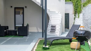 A patio with outdoor furniture, a barbecue grill, and a staircase. - Latitude 37 (Kalamata)
