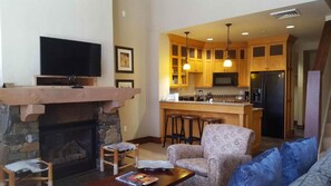 55-inch LCD TV with cable channels, video game console, table football