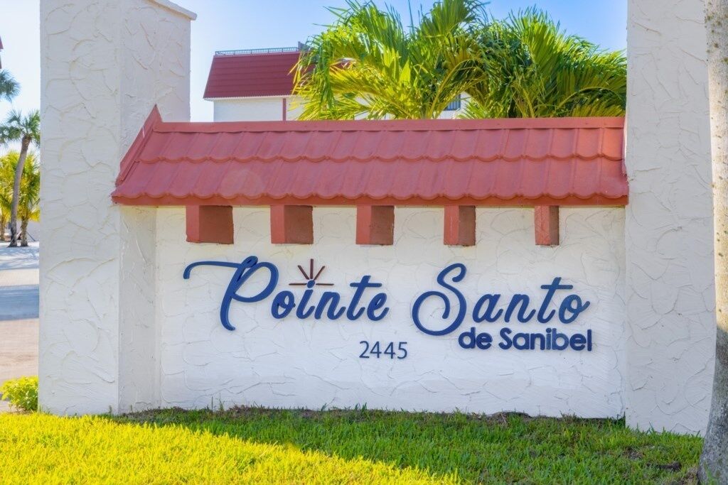 A sign for Pointe Santo de Sanibel with the number 2445.
