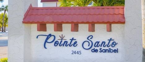A sign for Pointe Santo de Sanibel with the number 2445.