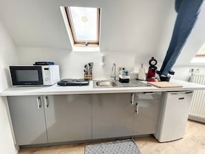 Fridge, microwave, stovetop, coffee/tea maker